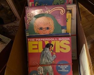 Box containing over 75 paperdoll books.