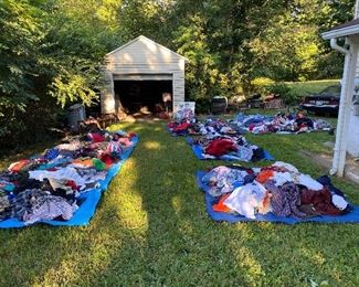 Some individually priced items are on the porch, but most of the clothing is on tarps in the back. Friday still over 700 pieces back here! Y2K and newer tees—Star Wars and Marvel galore, 90s shirt brands like Chaps, Nautical, Tommy. 