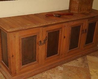 Worm wood cabinet with copper insets on the doors