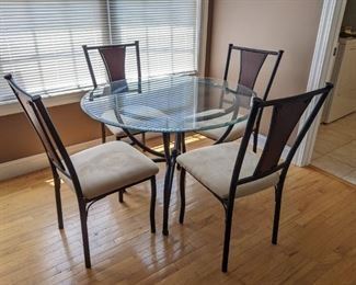 Glass topped table with chairs