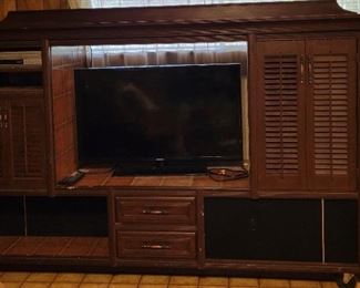 Entertainment center
Lighted cabinets behind the louver doors.