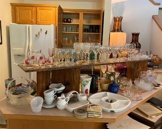 Basement Kitchen with lots of Glassware and serving items