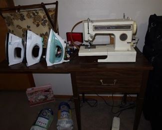 3 Irons - Sewing Machine in Cabinet 