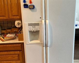 white side-by-side refrigerator/freezer with in-door ice water