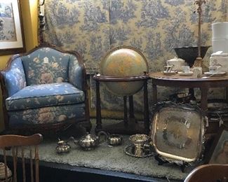 This nice setting features 1940's caved frame upholstered chair, world 1950's globe with light, Goose nect lamp 1940's, Silver, framed prints and china