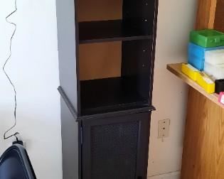 Black accent shelving unit with base cabinet