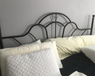 King sized iron bed.