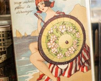 This postcard's special feature is a hidden set of tiny pictures that unfolds from under the umbrella. Most postcards are in standard frame sizes - ready to be added to any decor. 