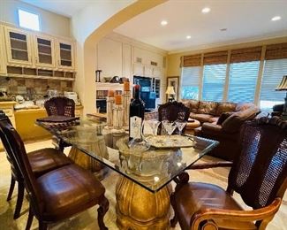 Glass top dining table
Cane  back Tommy Bahama style dining chairs
By Thomasville