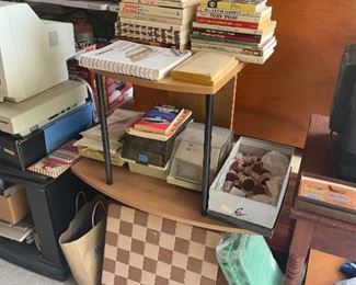 Collection of chess + checkers books, boards, and pieces