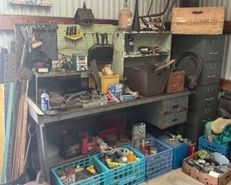 Metal work bench loaded with tools 