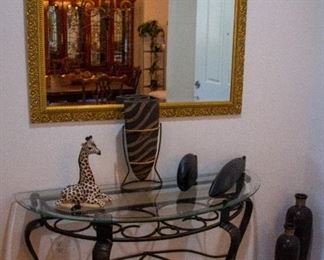 Glass table, mirror, and decorations