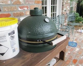 Green egg baker grill with stand.