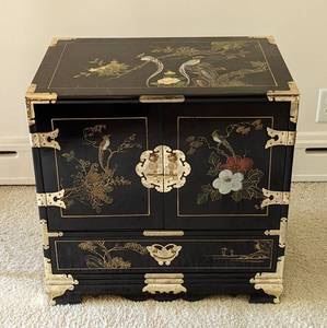 Painted Chinese Lacquered Chest/Cabinet. Beautiful and intricate details outside! The inside has plenty of storage for your small treasures! Measures 24” wide, 16” deep and 23.5” high.