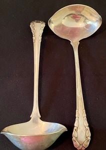 Two Georg Jensen Sterling Silver Ladles in Lily of the Valley. Each measuring about 7” long. Weight of about 142 grams. 