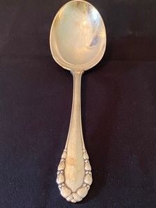 Georg Jensen Sterling Silver Serving Spoon.  Measuring about 9.6" with the bowl of the spoon at 3.5" 
Weight of about 118.72 grams. 