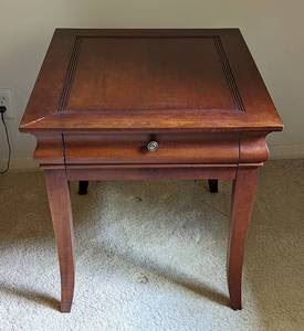 Hekman Wood Side Table. There are some scratches on the top that can be seen in the photos. Measures 27.5” x 23.5” and 24” high.