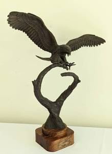Bronze Eagle Sculpture by S.A. Efron. There is some damage/scuffs on the wood base that can be seen in the photos. Measures 17.5” high and 4.25” x 4.25” at the base.