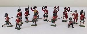 Vintage Tin/Lead Toy Soldiers. Most have light paint wear and several are damaged. All measure about 2.5” high.