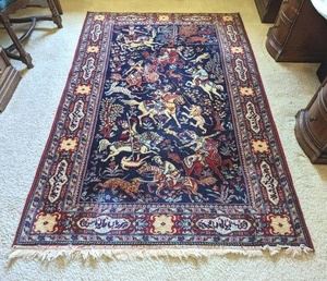 Luristen Belgian Wool Area Rug. There is some wear on the fringes that can be seen in the photos. Measures 130 x 200 (likely in centimeters) 