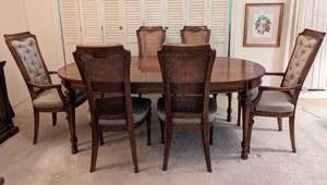 Vintage Drexel Dining Table and Chairs. There are some light scratches on the tabletop and wear/stains on several of the chairs upholstery. The table as pictured measures 40” x 76” and 29” high