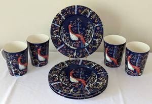 iitalia Taika Dish Set. Some of the plates have light scratches. Includes four mugs and four plates measuring 8.75” in diameter.