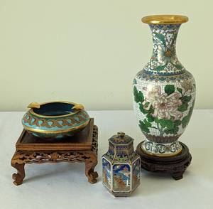 Cloisonné Ashtray, Vase and Petite Jar. There is some light wear that can be seen in the photos. Includes the pictured stand. The vase measures a little over 8” high and 2” in diameter at the top.