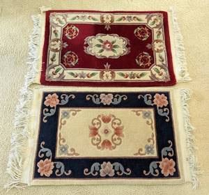 Pair of Colorful Accent Rugs. Both have wear that can be seen in the photos. The red rug has stains and unknown if removable with cleaning. Each  measures about 24” x 41”.