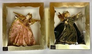 Two Koestel Wax Ornaments made in West Germany of which the largest measures 7 inches tall.