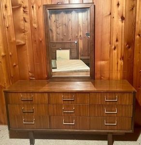 Vintage Mid Century Dresser with Removable Mirror. The dresser measures 60x17.5x29 inches and the mirror measures 25x29 inches. 