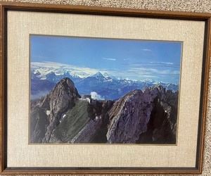 Beautiful Scenic Mountain Framed Print that measures 19x24 inches. The artist is unknown.