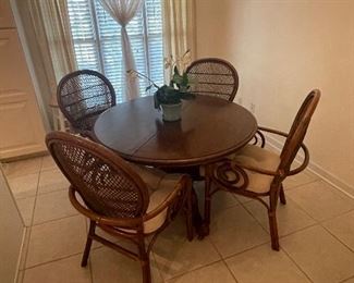 Real Rattan!  Super comfortable vintage dinette set.  Comes with 6 chairs and a leaf.  Pic shown without leaf and 4 chairs.