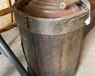Antique wood wrapped oil barrel