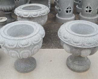 Classic geranium (or your choice) flower pots. But seriously red, white or pink geraniums would look amazing