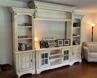 This beautiful entertainment center is made for the streamlined TV's of today!  This is not your older style, deep set entertainment center.  This is a narrow styled piece that will complement your TV room.