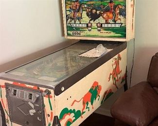 Bally "Bow and Arrow" pinball machine released in 1974.  The lights work when plugged in, but some work needed on the mechanics.