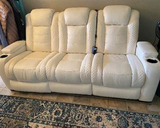 White leather sofa with power recliners,  receipts from Ashley Furniture in 2019. Like new. 
