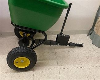 New John Deere pull behind spreader.