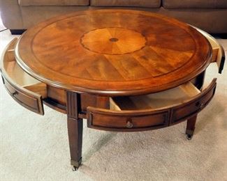 Ashley Furniture Round 4-Drawer Cocktail Table With Inlaid Top On Brass Casters, 19.5" x 40"