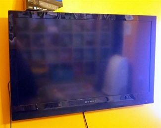 Dynex 40" LCD Television, Model DX-40L150A11, Powers On, With Wall Mount, And RCA Digital TV Converter In Box