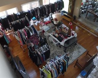 Shot from upper level of racks of women's  clothes sizes 1x to 3x also area rug along  with Holiday Miscellaneous                       