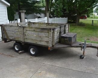 Two axle trailer, heavy duty, metal bed is in very good condition. Wood sides