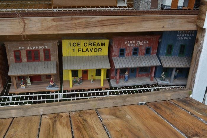 Multiple G Scale buildings, some plastic, some wood, mostly hand done. 