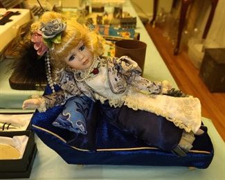 Doll Laying Down On Chaise Lounge