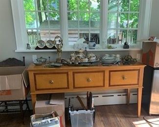 three pull-out draw server on legs  / next to it is an apartment-size refrigerator 