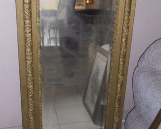 Large  gold ornate framed beveled mirror
