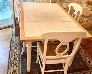 Tile top kitchen table with 4 rattan seat chairs
