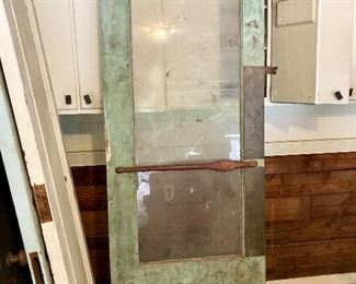 Architectural salvage door from Atlanta building. 8’ tall with brass handle and intact glass, no cracks.