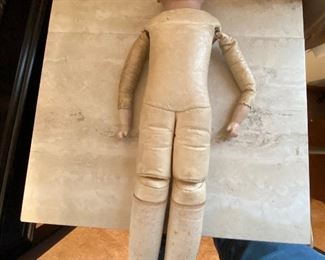 ANTIQUE GERMAN DOLL: LEATHER BODY, CLOTH LEGS & ARMS,CHINA HEAD & HANDS; NO HAIR, NO EYES.