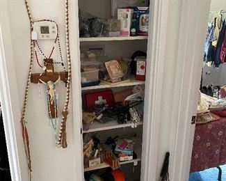 Hanging Crucifix with Hidden Compartment and relics; Whip; Home Healthcare items; Personal Care items; Massager; Thermometers; Perfume; Curling Irons; Shoehorns; Hanging Artwork of Red, White, and Blue Horse, and more